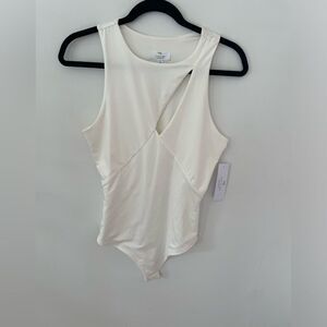 NWT Live in the moment White Body Suit size large with small cut out